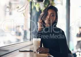 Dont just be plain coffee, be iced coffee. a beautiful young woman drinking a iced coffee in a cafe.