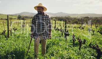 Ditch the desk, embrace the green. a mature man working on a farm.