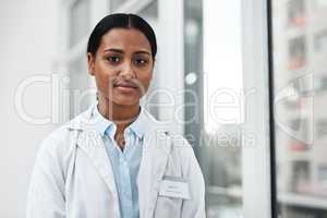 Here to assist with your guidance to good health. Portrait of a young doctor standing in a hospital.