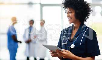 Nurse, medical professional and healthcare worker with tablet and afro feeling happy after checking positive test result reports on technology. Smiling and friendly doctor ready to help in hospital