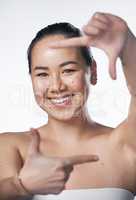 Next time you think of beautiful things, dont forget to include yourself. a beautiful young woman posing against a white background.