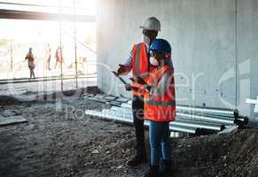 Profitable relationships are built on a foundation of trust. a young man and woman having a discussion while working at a construction site.