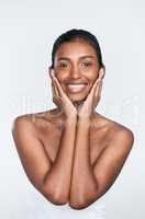 No one cares for your skin like you do. a beautiful young woman posing against a white background.