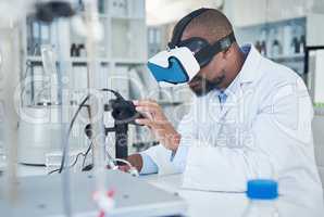 Advanced technology for advanced medical research. a scientist using a virtual reality headset while conducting research in a laboratory.