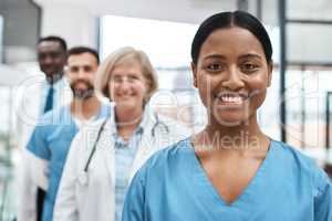 Exceptional healthcare is exactly what we deliver. Portrait of a group of medical practitioners standing together in a hospital.