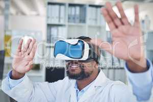 The more we evolve, the more we resolve. a scientist using a virtual reality headset while conducting research in a laboratory.