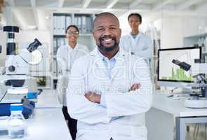 Science changes the world in big ways. Portrait of a group of scientists working in a lab.