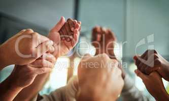 Diverse people holding hands in teamwork, success and support while showing solidarity, trust and unity in office. Closeup of business team, men and women standing together for equal workplace rights