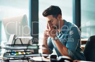 Stressed businessman with pain, headache or stress while working at office and looking tired exhausted and unhappy. Corporate worker feeling burnout and overworked failing to reach a deadline crisis