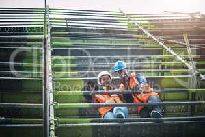 Ensuring the smooth execution of every phase of the construction process. a young man and woman working at a construction site.