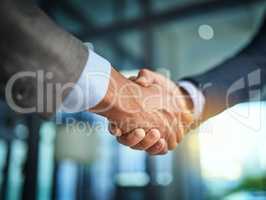 Handshake, collaboration and businessmen celebrating and congratulating on success for a sealed deal. HR manager hiring employee after successful interview. Hands of partners shaking on agreement