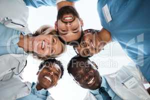 The experts in excellent healthcare. Portrait of a group of medical practitioners standing together in a huddle.