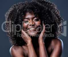 I heard that happiness makes you glow. Studio shot of a beautiful young woman with glowing skin.