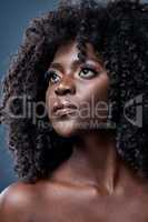 Im owning my own beauty and I want you to own yours. Studio shot of a beautiful young woman with glowing skin.