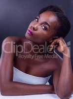 Her beauty is simply exquisite. Studio portrait of a beautiful young woman posing against a black background.