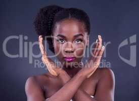 I dont allow any negative vibes near me. Studio portrait of a beautiful young woman posing against a black background.