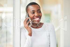 Sounds good, lets get on that. a young businesswoman using a smartphone in a modern office.