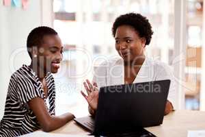 Their latest invention is sure to make waves. two businesswomen working together on a laptop in an office.