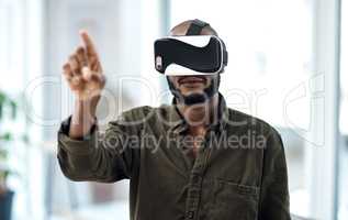 Experience business like never before. a young businessman using a virtual reality headset in a modern office.