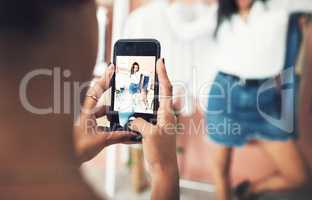 Click the link to shop these online. a blogger having her picture taken on a smartphone.