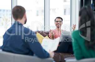 A passionate entrepreneurial spirit takes a business places. a group of young businesspeople having a meeting in a modern office.