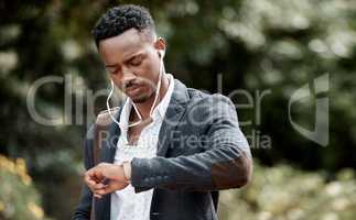 Time is an important tool, leverage it wisely. a young businessman checking the time while walking through the city.