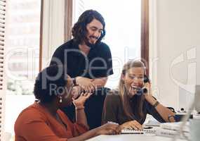 Sounds like they have something to celebrate. a group of businesspeople looking excited while making a telephone call in an office.