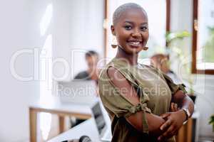 Hard work and dedication leads to a successful career. Portrait of a young businesswoman standing in an office.