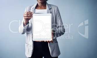 Woman holding a white screen tablet looking professional mockup. Young and isolated black business corporate executive standing alone with blank digital device against a blue background copyspace