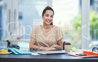 Creativity is a driving force behind my business growth. Portrait of a young designer working in an office.