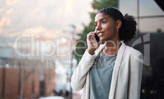 Talking on a phone, communication and networking with a young, confident and ambitious young business woman on a balcony. Professional and creative designer on a call for work discussion and planning