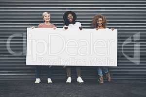 Diverse women holding blank poster, copy space board and placard sign to promote, market and advertise opinion and female empowerment. Group portrait of women endorsing with billboard in city