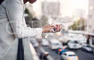 Phone in the hands of a woman for communication, networking and calling while standing on a balcony above a urban city street. Corporate professional taking a break and browsing on a mobile app