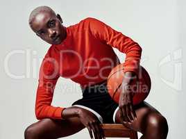 Trust your talent. Studio shot of an attractive young woman playing basketball against a grey background.