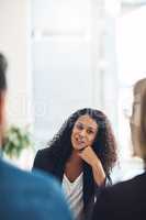 Talking psychologist counseling a couple in routine marriage therapy in a clinic. Curious, confident and young mental healthcare professional helping husband and wife communicate