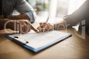 Lawyer, broker or HR manager pointing finger at contract and signing agreement with client or employee. Financial advisor asking for womans signature for insurance, legal paperwork or claim form