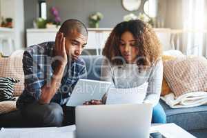 Stressed, worried and anxious couple doing finances, budget and internet banking. Upset couple looking at savings and online investment. Man and woman struggling with debt, loan and bond payment