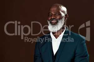 Failing doesnt make you a failure, keep going. Studio shot of a mature businessman posing against a brown background.