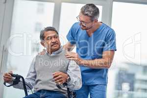 Your recovery is going really well. a nurse helping a senior man with a walker.