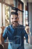 Winning, celebrating and cheering young successful male entrepreneur happy for success in his business. Portrait of an excited and startup owner feeling joy, cheerful and positive for his company