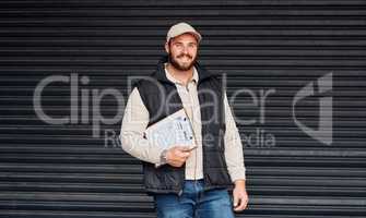 Working hard to deliver an efficient service. Portrait of a courier holding a clipboard.