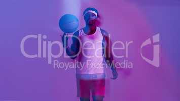 Be the player that everyone remembers. Red filtered shot of a young sportsman posing with a basketball in the studio.