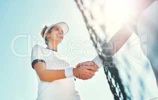 Be graceful in your victories and in your defeats. an attractive young female tennis player shaking hands with an opponent outdoors on the court.