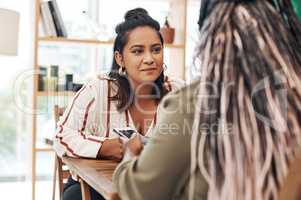 So, how have you been. two young women chatting at a cafe.