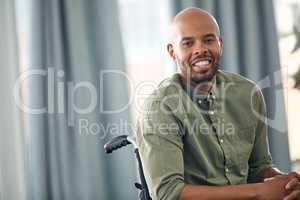 I still have so much to be grateful for. a young man sitting in his wheelchair at home.