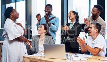 Weve always admired your hard work and dedication. a group of businesspeople applauding their colleagues in an office.