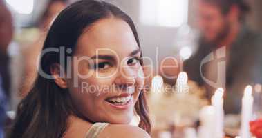 No one throws a party like we do. Portrait of a young woman having a dinner party with friends at home.