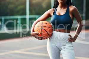 I belong on the court. an unrecognizable sportswoman standing on the court alone and holding a basketball during the day.