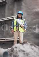Running her site professionally. Cropped portrait of an attractive young female construction worker working on site.