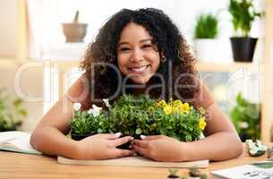 These are my pride and joy. Cropped portrait of an attractive young female botanist working in her florist.